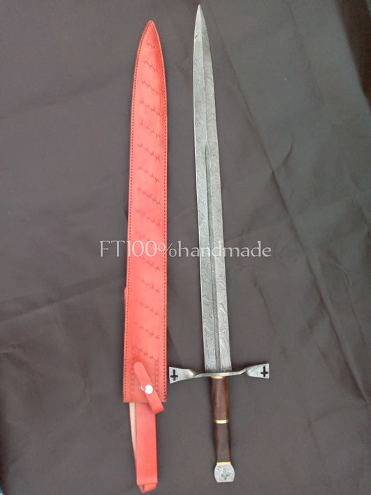 Handmade Damascus steel sword with rosewood and brass handle; leather sheath included.